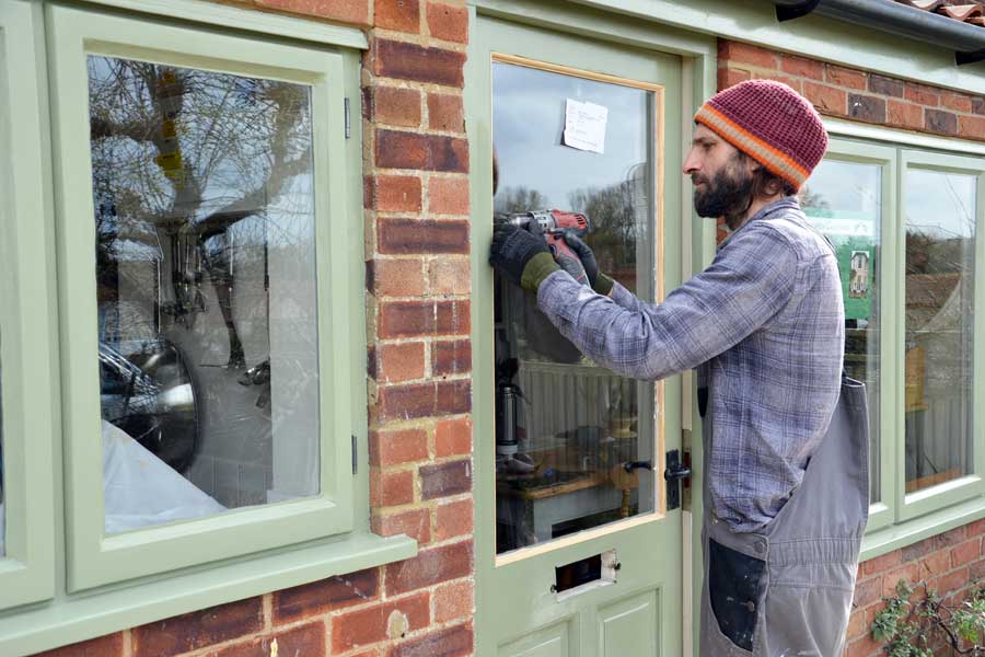 Luke working on door frame